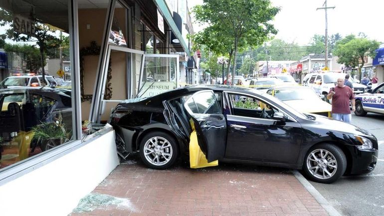 A car ran into a storefront at Provenance Antiques at...