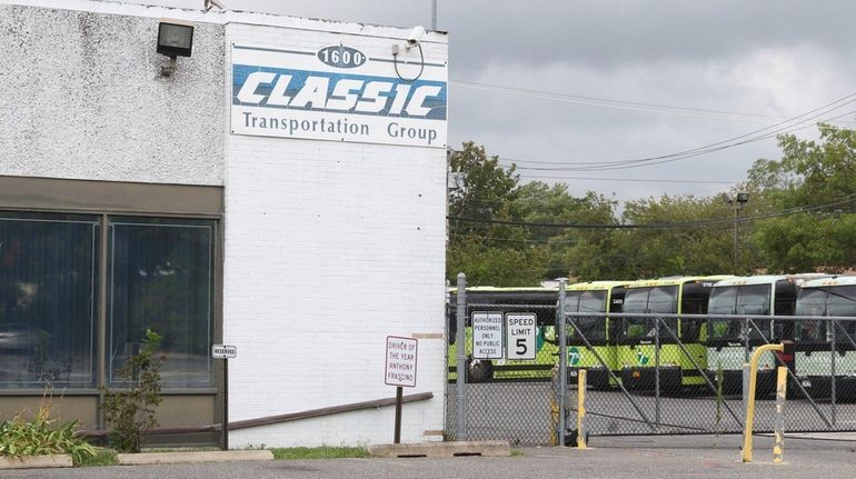 Buses are parked at the offices of Classic/Luxury and 7...