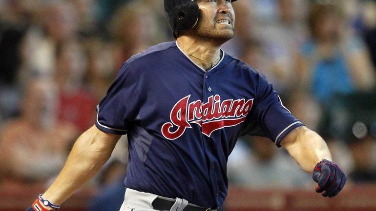 Johnny Damon #33 of the Cleveland Indians reacts as he...