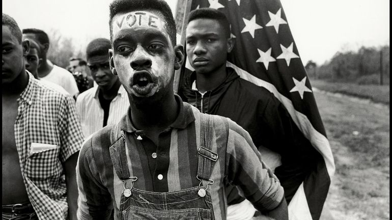 Civil rights demonstrators march from Selma to Montgomery, Alabama, in...