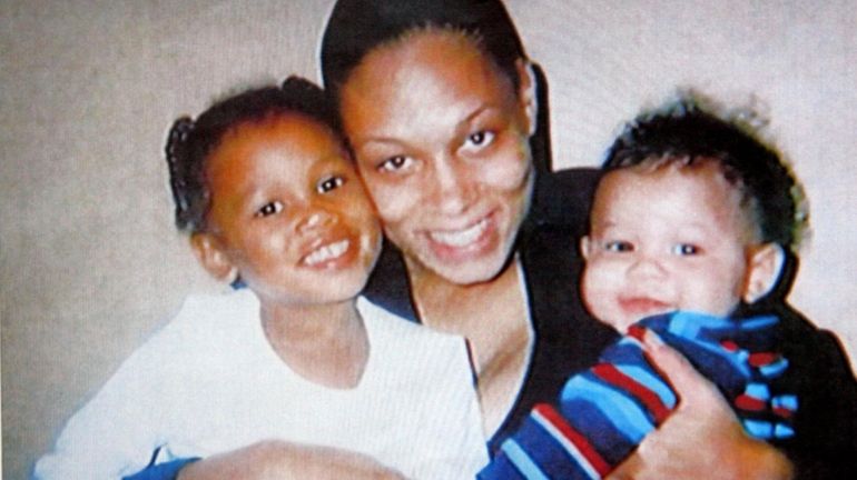 Jo'Anna Bird, seen here with her children, was found stabbed...