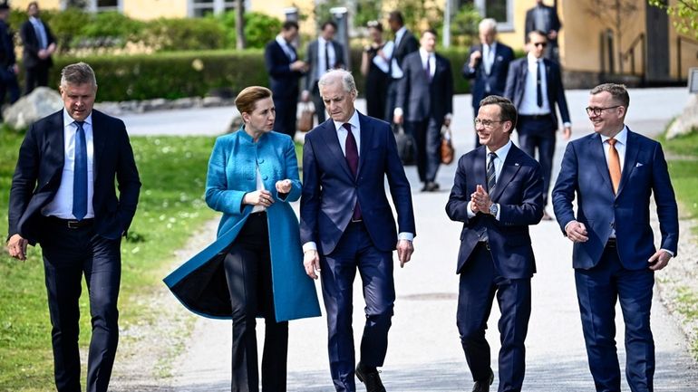 Sweden's Prime Minister Ulf Kristersson, second from right, welcomes the...