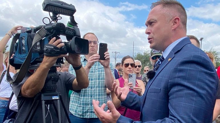 State Rep. Justin Sparks, R-Wildwood, fields questions from reporters during...