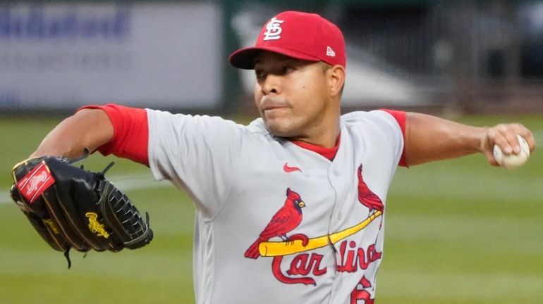 Cardinals starter Jose Quintana pitches against the Pirates during the...