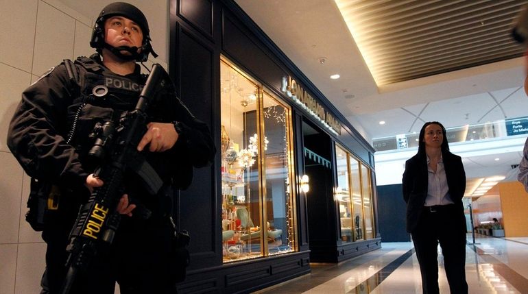 Nassau Police patrol the halls of the Roosevelt Field Mall...