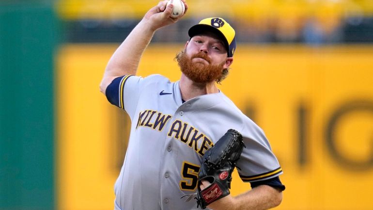 Milwaukee Brewers starting pitcher Brandon Woodruff delivers during the first...