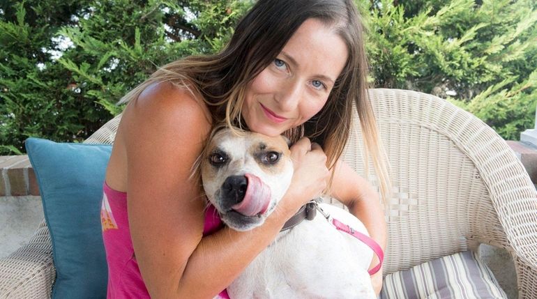 Christine Filardi with Pilgrim, one of her five dogs. All...