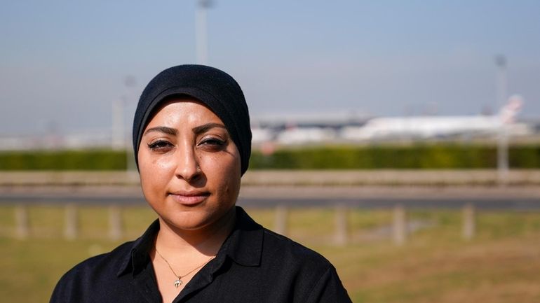 Maryam al-Khawaja poses for a photograph outside Heathrow airport, in...