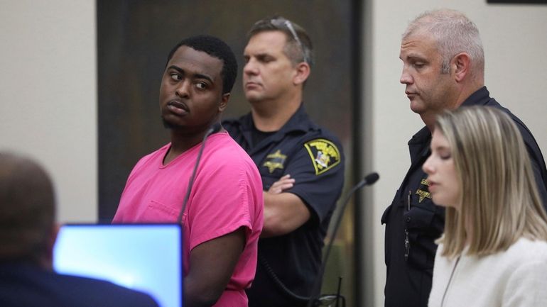 Kelvin Vickers, 21, left, is arraigned in Rochester City Court...