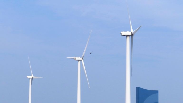 Land-based wind turbines in Atlantic City, N.J., turn on July...