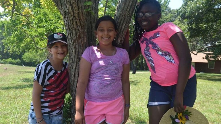 From left, Mikayla Smith, 9, of Long Beach, Kaitlin Hartman,...