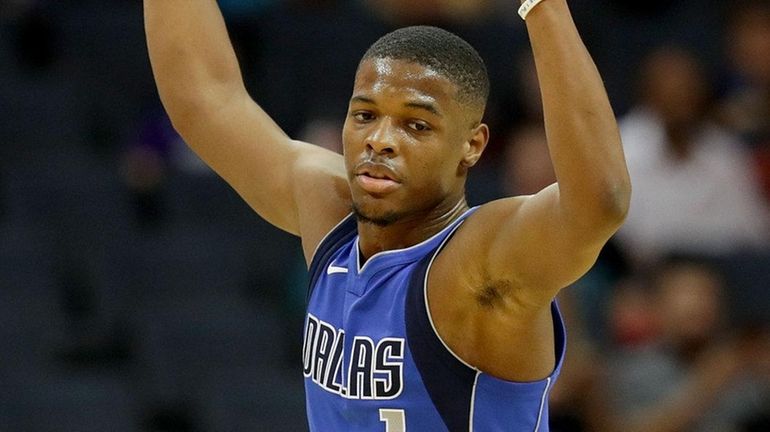 Dennis Smith Jr. of the Mavericks reacts after a basket...