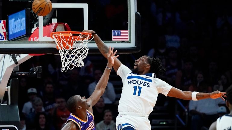 Minnesota Timberwolves center Naz Reid (11) misses a dunks as...