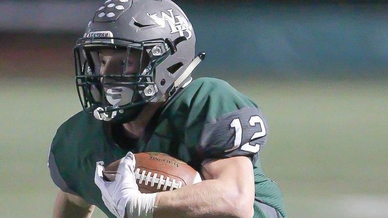 Westhampton's Dylan Laube runs the ball against Sayville on Oct....