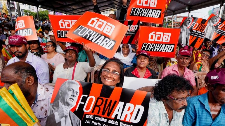 A woman supporter of Sri Lankan President and independent presidential...