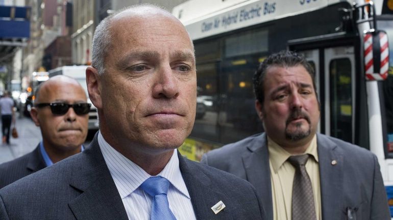 Long Island Rail Road lead union negotiator Anthony Simon, center,...