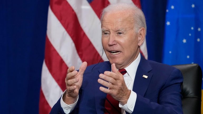 President Joe Biden speaks as he meets with Brazil's President...