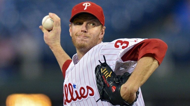 Roy Halladay of the Phillies delivers against the Marlins at...