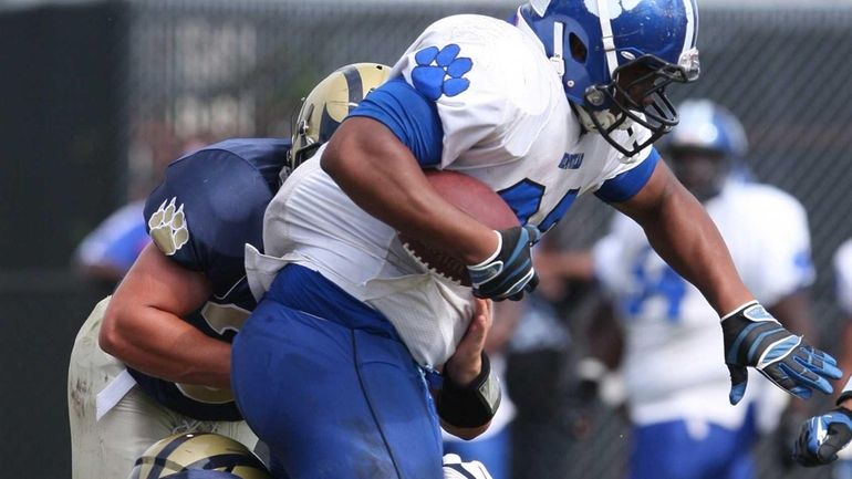 Hempstead's Darius Meadors gets brought down against Baldwin. (Sept. 21,...