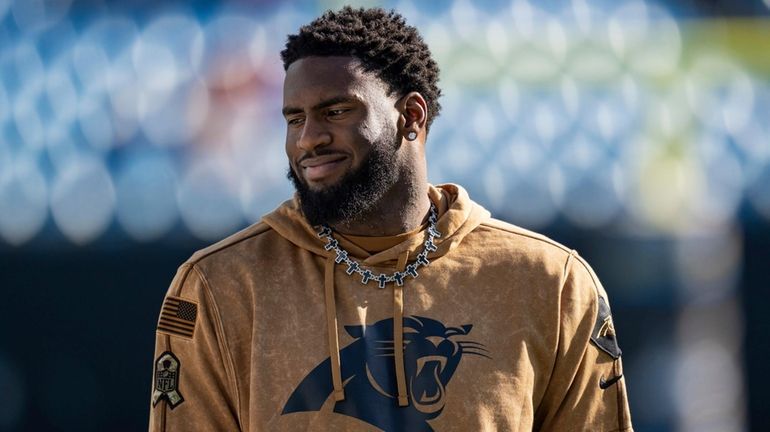 Panthers linebacker Brian Burns warms up before an NFL fooball...