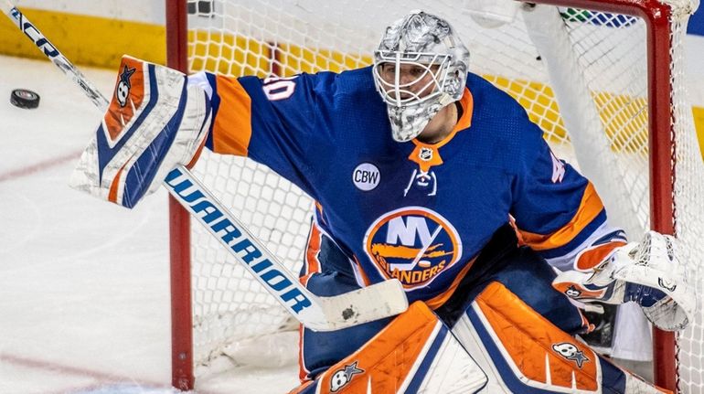 Islanders goalie Robin Lehner makes a stop against the Hurricanes in the...