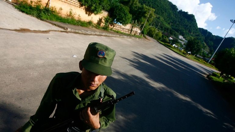 A soldier from the United Wa State Army is seen...