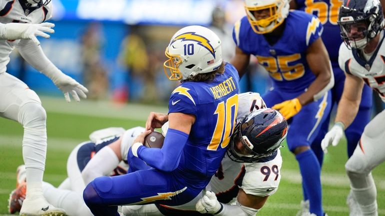 Denver Broncos defensive end Zach Allen (99) sacks Los Angeles...