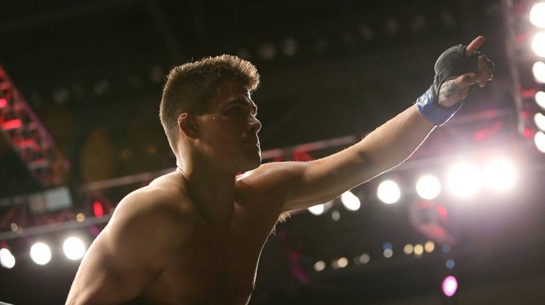 Mickey Gall celebrates his victory over CM Punk at UFC...