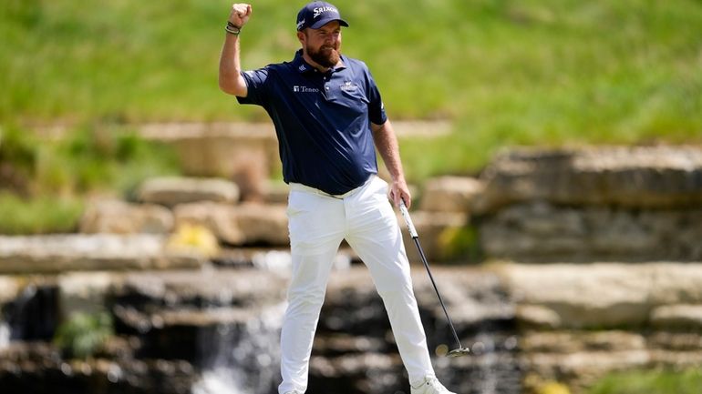 Shane Lowry, of Ireland, celebrates after a birdie on the...