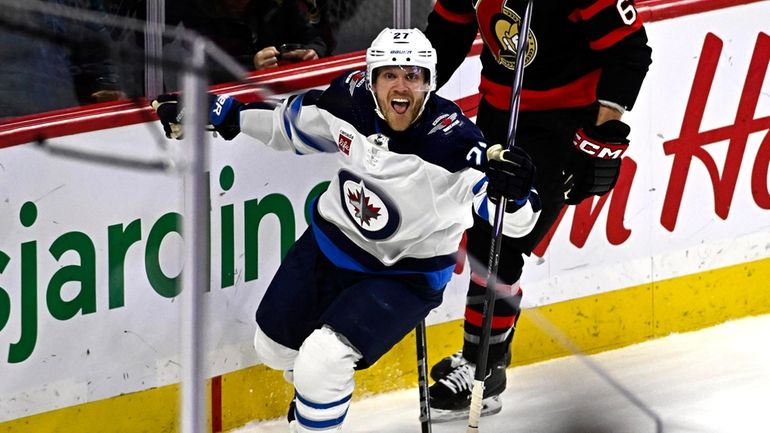 Winnipeg Jets left wing Nikolaj Ehlers (27) celebrates game-winning goal...