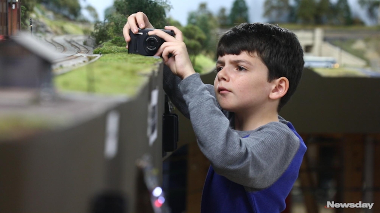 Visitors learn how to operate a train - Newsday