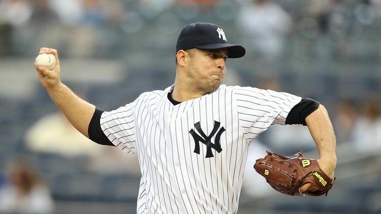 Javier Vasquez #31 of the New York Yankees pitches against...