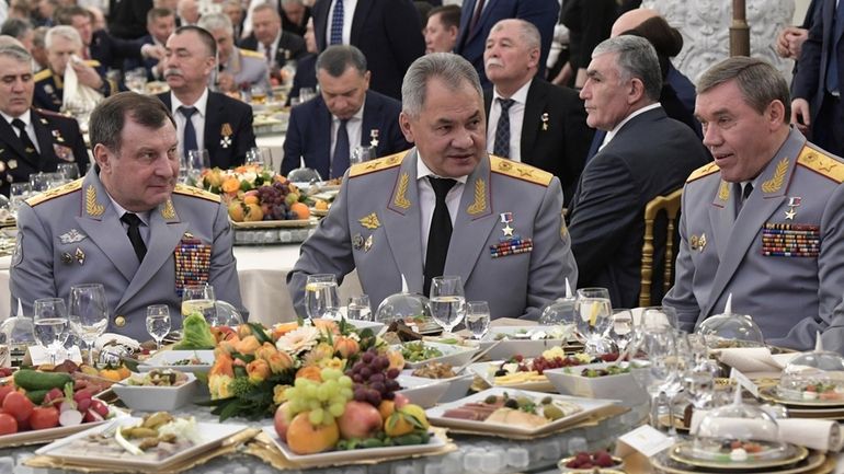 Deputy Defense Minister Dmitry Bulgakov, left, Defence Minister Sergei Shoigu,...