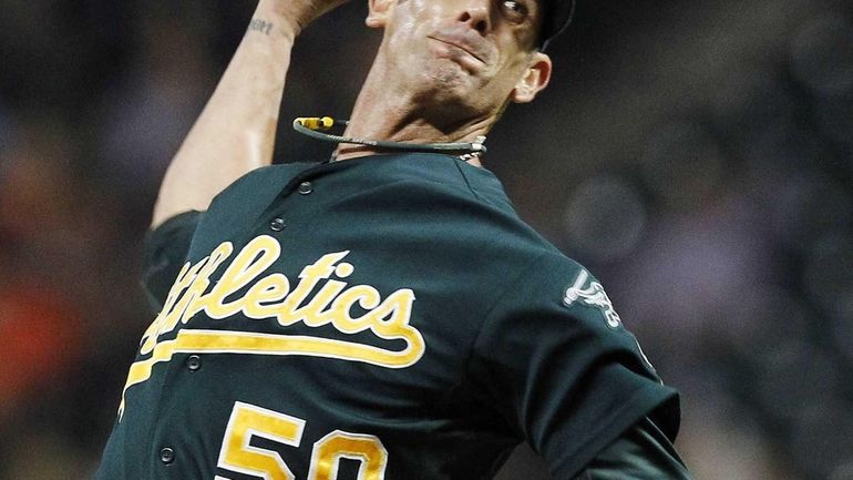 Former Oakland Athletic Grant Balfour delivers a pitch against the...