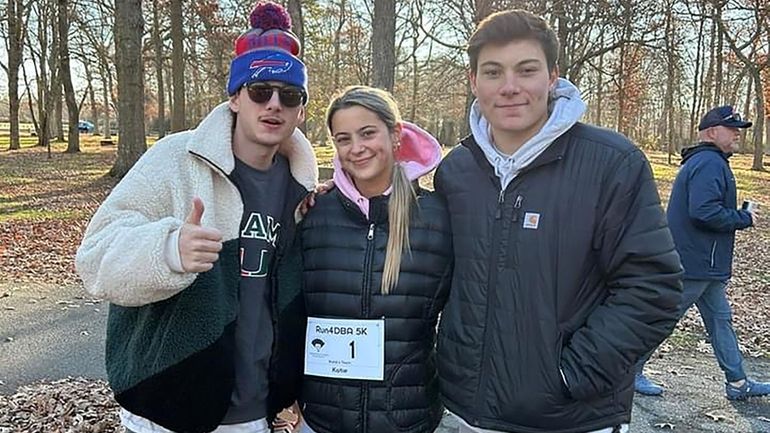 The Trebing siblings — Cal, left, Katie and Christopher — before the...