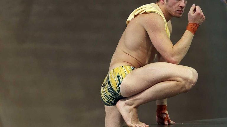 Matthew Mitcham of Australia looks on during a diving training...