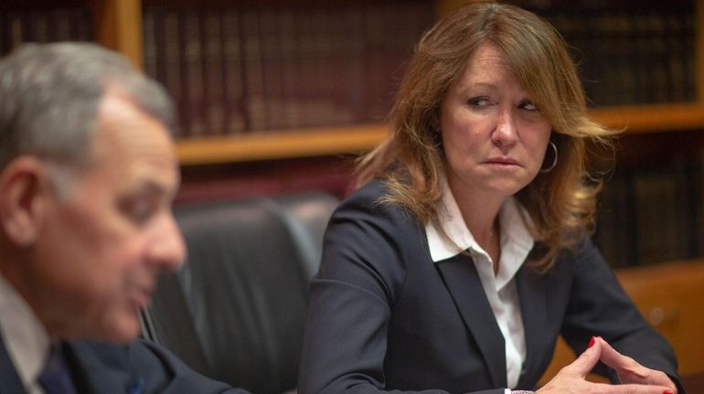 Attorney Thomas Liotti and his client Katuria D'Amato, seen in...