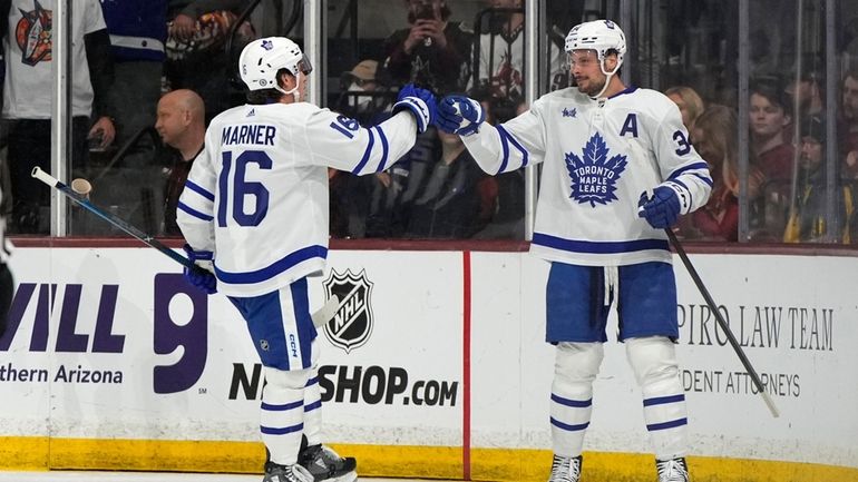 Toronto Maple Leafs center Auston Matthews (34) celebrates with right...