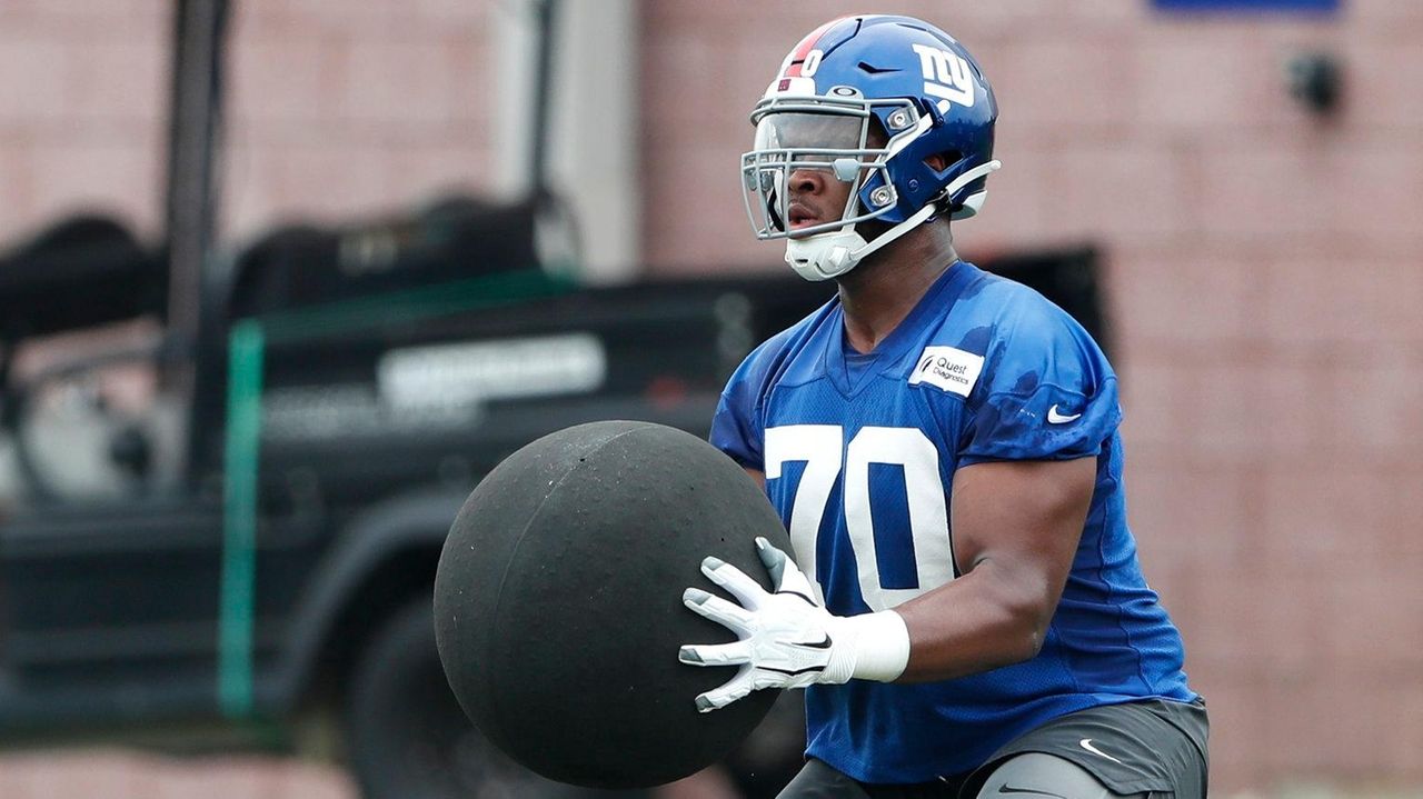  Foto zu Giants' Evan Neal will have to adjust to losing - Newsday 