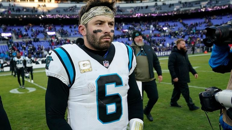 FILE - Carolina Panthers quarterback Baker Mayfield (6) walks off...