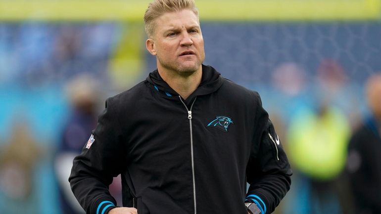 Carolina Panthers quarterbacks coach Josh McCown walks on the field...