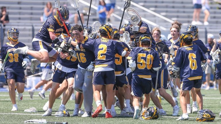 Northport celebrates their win during the Long Island boys lacrosse...