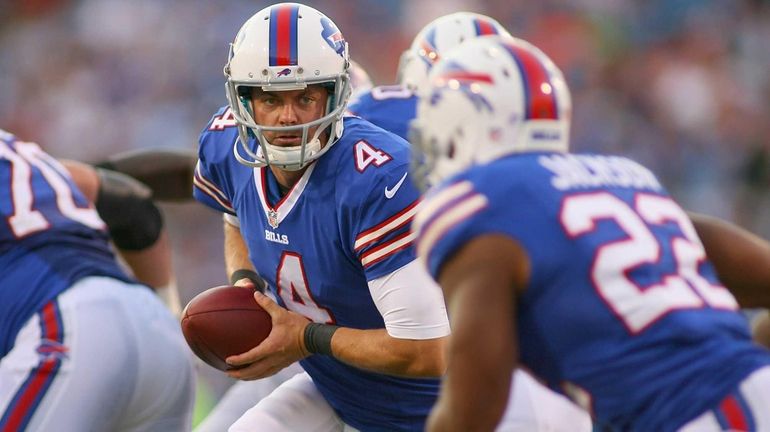 Kevin Kolb of the Buffalo Bills readies to hand off...