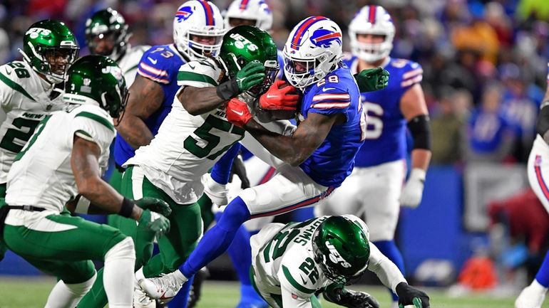 Buffalo Bills running back Latavius Murray (28) is tackled by...