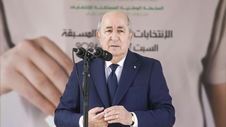 Algerian president and candidate for re-election Abdelmajid Tebboune speaks after...