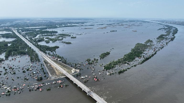 Houses are seen underwater in the flooded village near Kherson,...