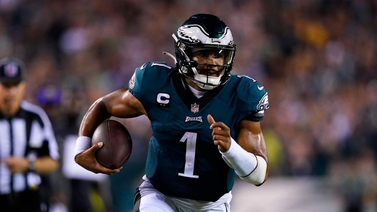 Philadelphia Eagles quarterback Jalen Hurts (1) runs up field during...