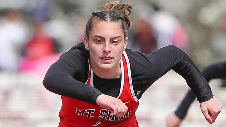 Mt Sinai’s Kate Del Gandio wins the 100-meter hurdles during...