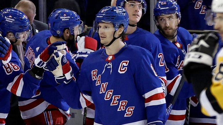 Jacob Trouba #8 of the Rangers celebrates his second period goal...