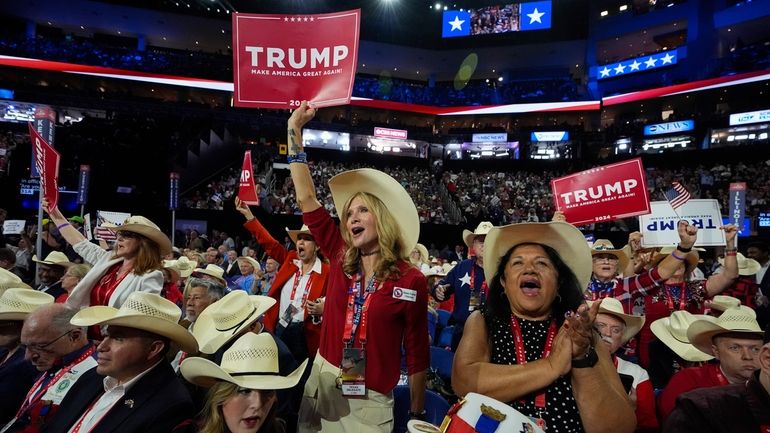 Texas delegates cheer during the Republican National Convention Tuesday, July...